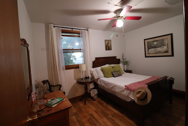 bedroom with ceiling fan and wood finished floors