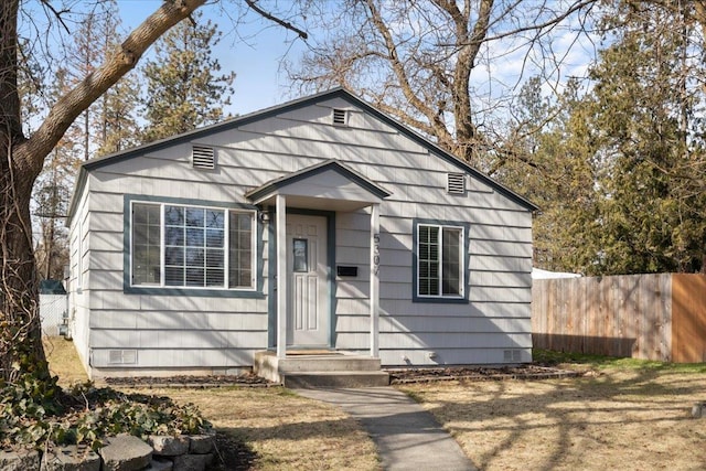 bungalow featuring crawl space and fence