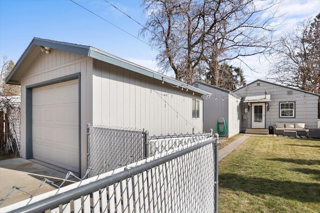 detached garage with driveway and fence