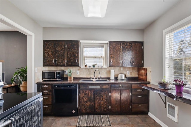 kitchen featuring dishwasher, stainless steel microwave, plenty of natural light, and a sink