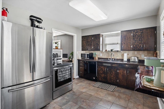 kitchen with a sink, stainless steel appliances, dark countertops, and dark brown cabinets