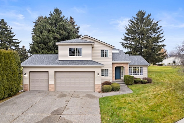 traditional home with a garage, driveway, a front lawn, and roof with shingles