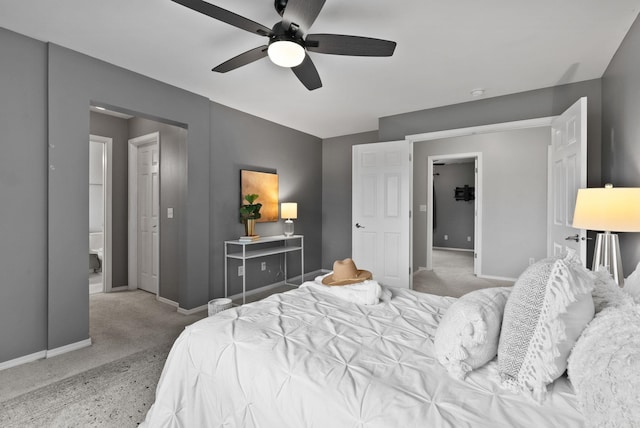 carpeted bedroom with baseboards and ceiling fan