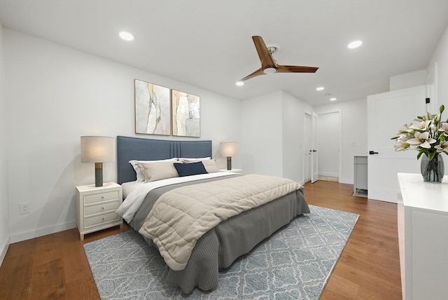 bedroom featuring recessed lighting, ceiling fan, and wood finished floors