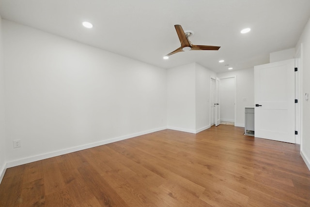 unfurnished room featuring recessed lighting, ceiling fan, baseboards, and light wood-style floors