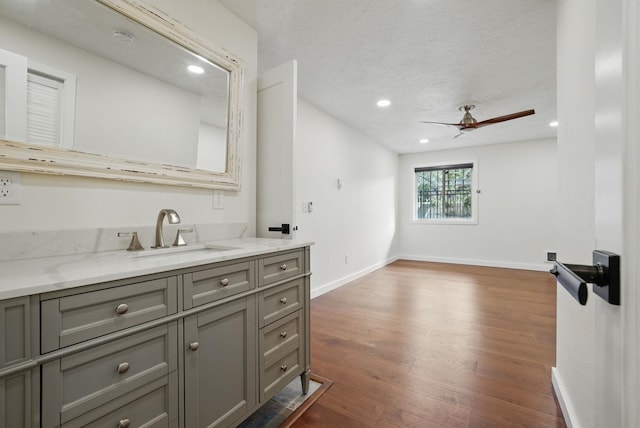 bathroom featuring recessed lighting, a ceiling fan, baseboards, and wood finished floors