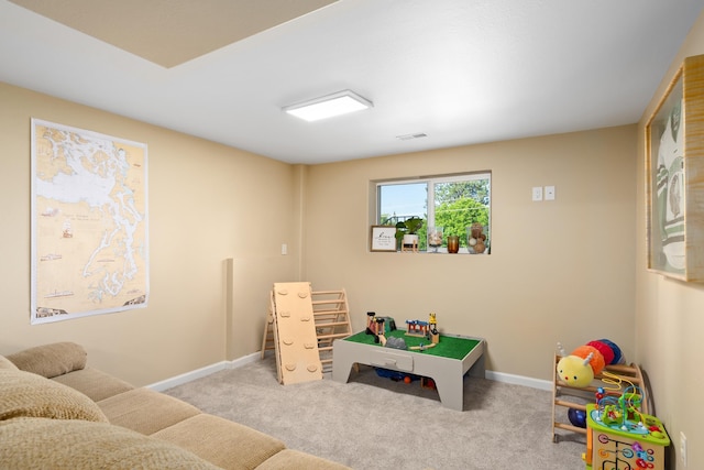 recreation room featuring baseboards and carpet floors