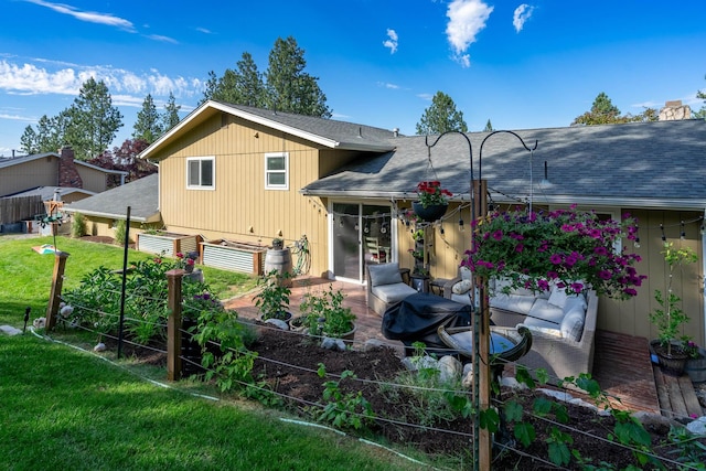 rear view of property with a yard, a patio, and roof with shingles