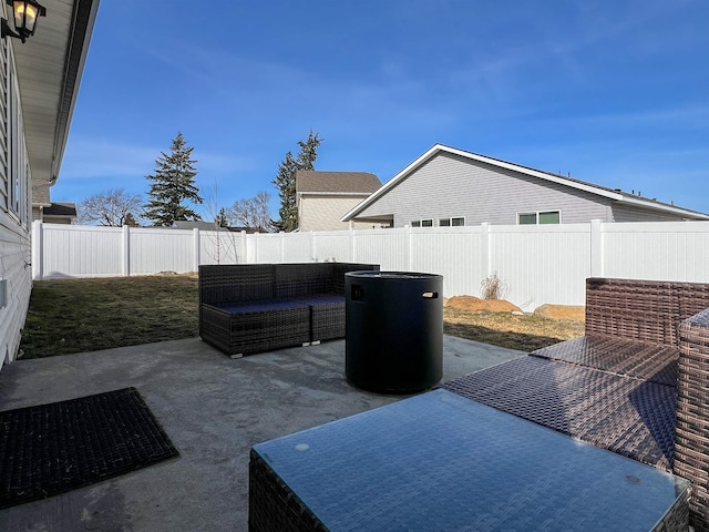 view of patio with a fenced backyard and outdoor lounge area