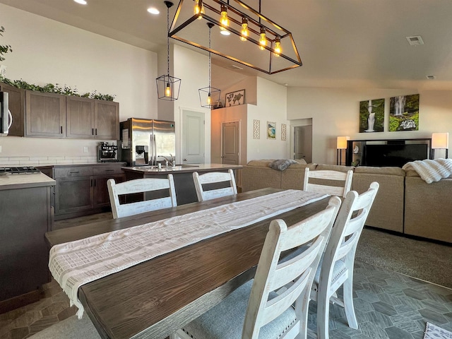 dining room featuring recessed lighting, visible vents, and high vaulted ceiling