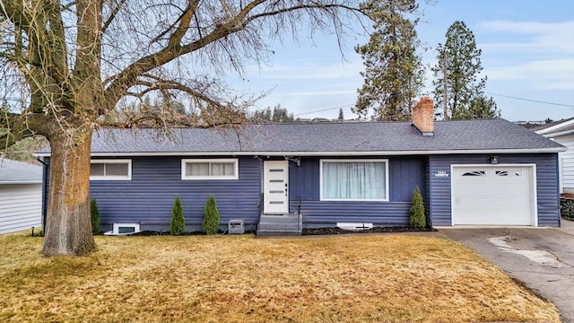 ranch-style home with a shingled roof, a front lawn, a garage, and a chimney