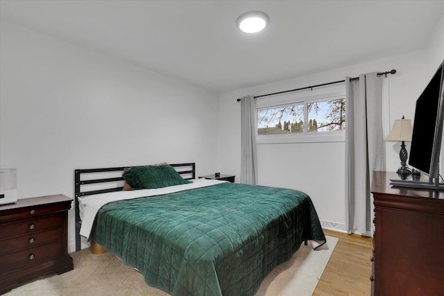 bedroom featuring light wood finished floors