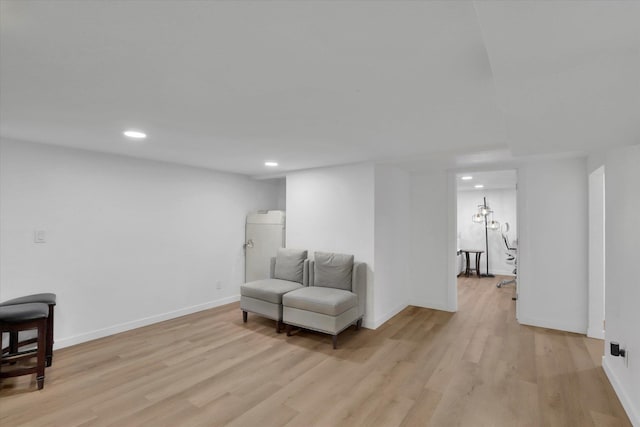 sitting room with recessed lighting, light wood-style flooring, and baseboards