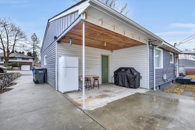 back of property featuring a patio area