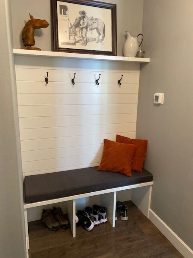 mudroom featuring wood finished floors and baseboards