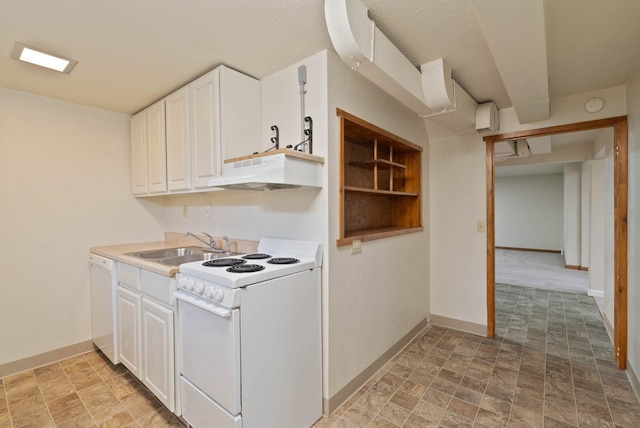 kitchen featuring white appliances, white cabinets, under cabinet range hood, and a sink