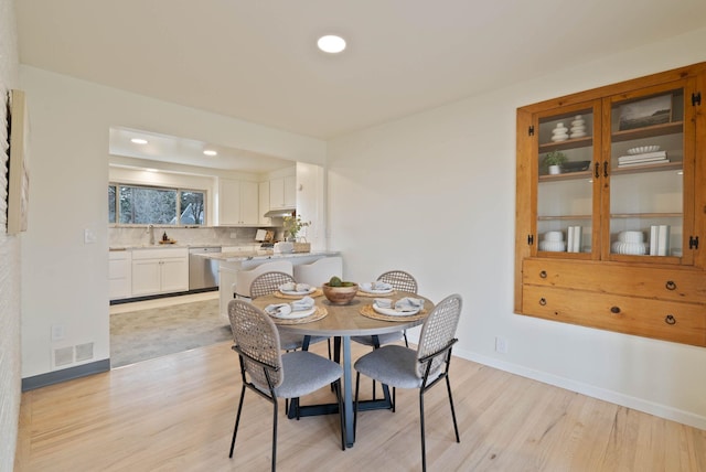 dining area with recessed lighting, visible vents, baseboards, and light wood finished floors