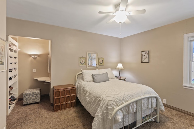 carpeted bedroom featuring a ceiling fan and baseboards