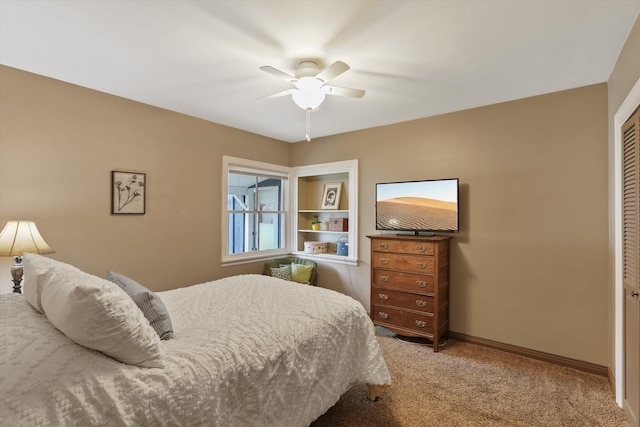 bedroom featuring carpet flooring, baseboards, a closet, and ceiling fan