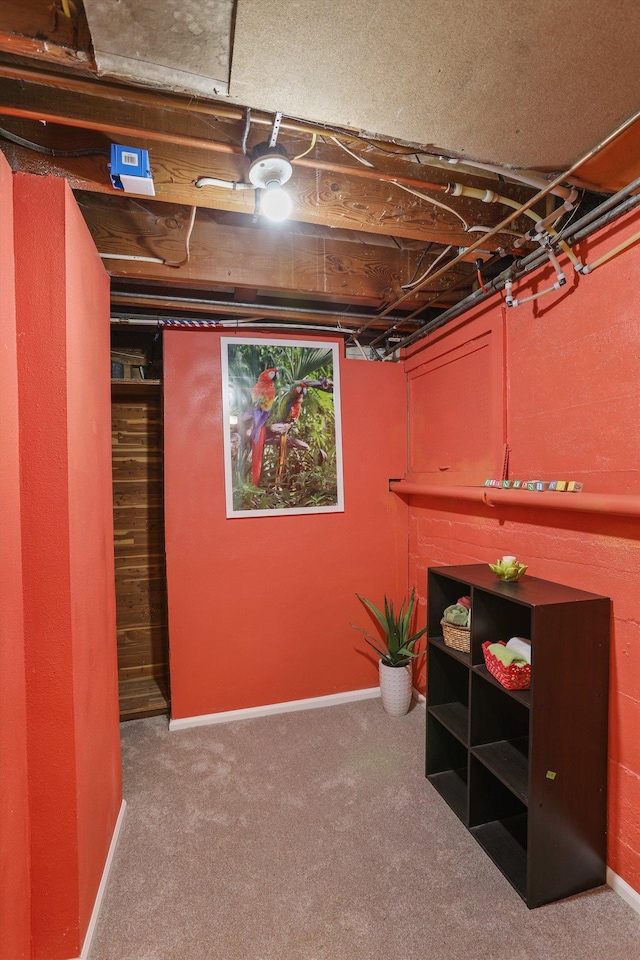 unfinished basement with baseboards and carpet floors