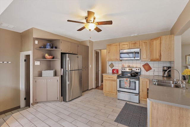 kitchen with a sink, open shelves, light brown cabinetry, and stainless steel appliances