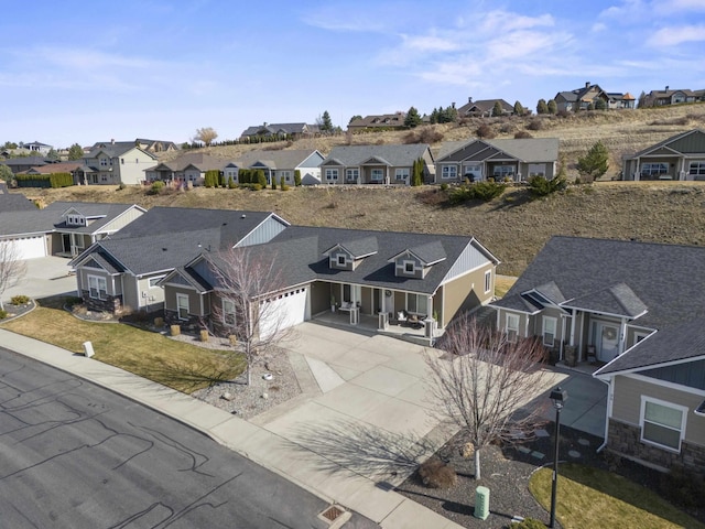 birds eye view of property with a residential view