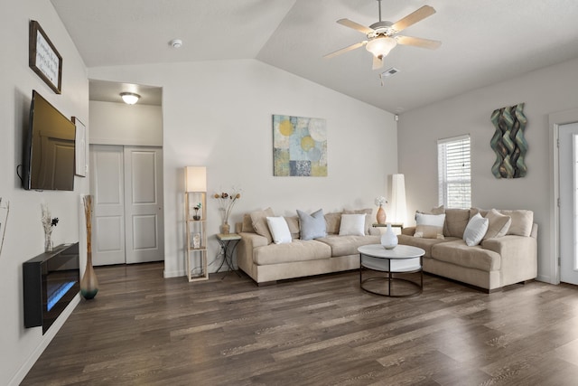 living room with dark wood-style floors, visible vents, high vaulted ceiling, and ceiling fan