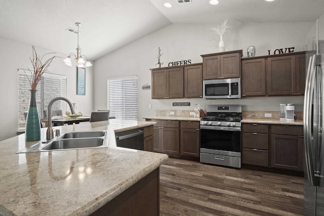 kitchen with visible vents, light countertops, dark wood-style floors, stainless steel appliances, and a sink