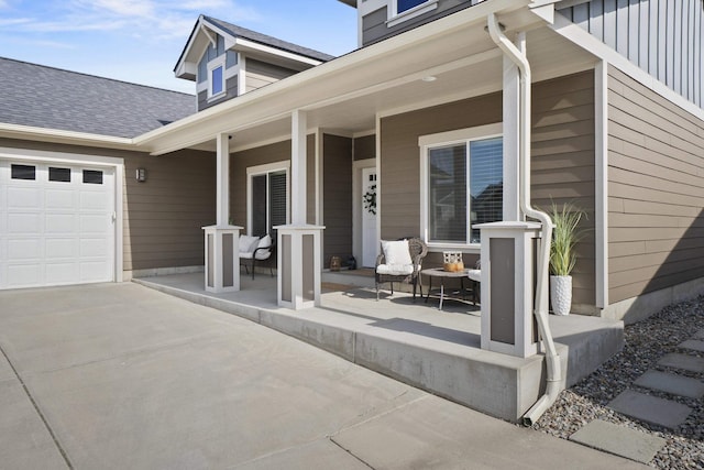 exterior space with a garage, covered porch, and concrete driveway