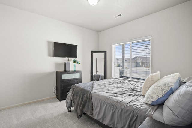 bedroom with visible vents, baseboards, and carpet floors