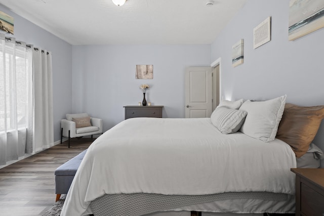 bedroom with wood finished floors