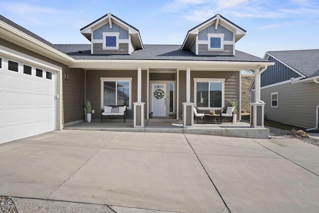 view of front of property featuring a porch and concrete driveway