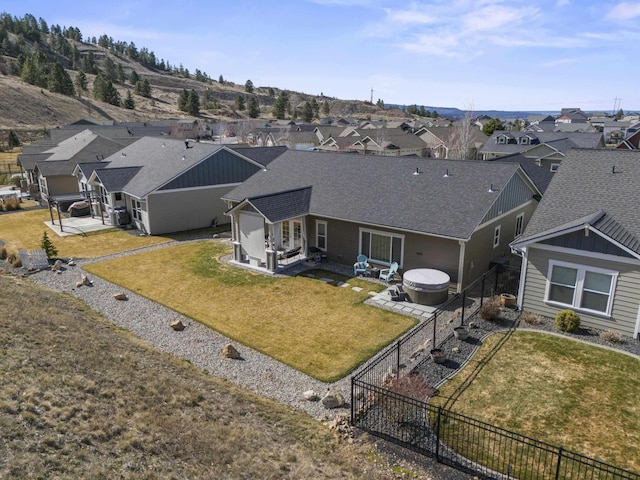 birds eye view of property with a residential view