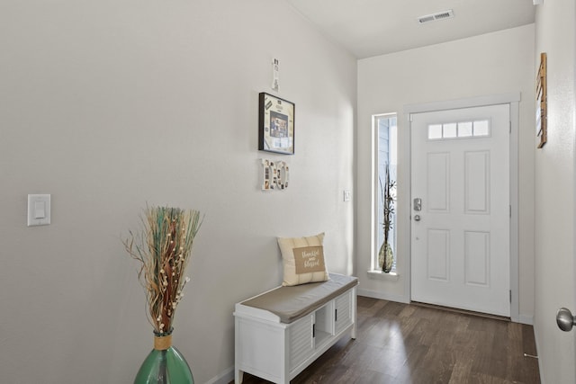 entryway featuring visible vents, baseboards, and dark wood-style flooring