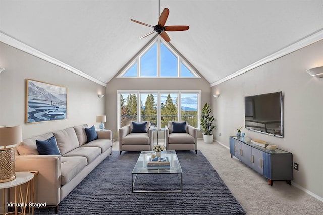 living area with ornamental molding, a ceiling fan, baseboards, and light carpet