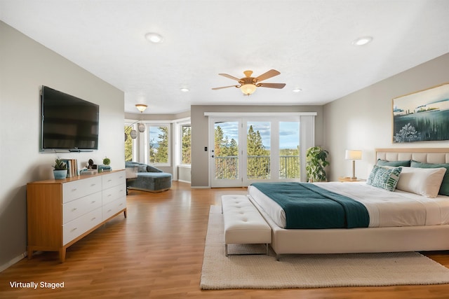 bedroom featuring recessed lighting, baseboards, light wood finished floors, and access to outside