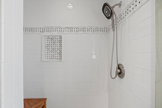 bathroom with a tile shower