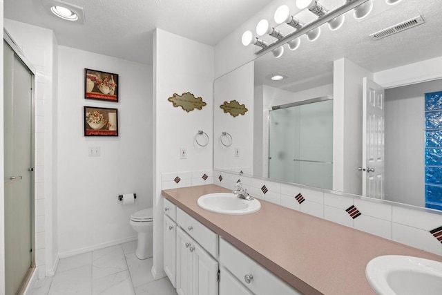 full bath with visible vents, toilet, marble finish floor, a stall shower, and a sink