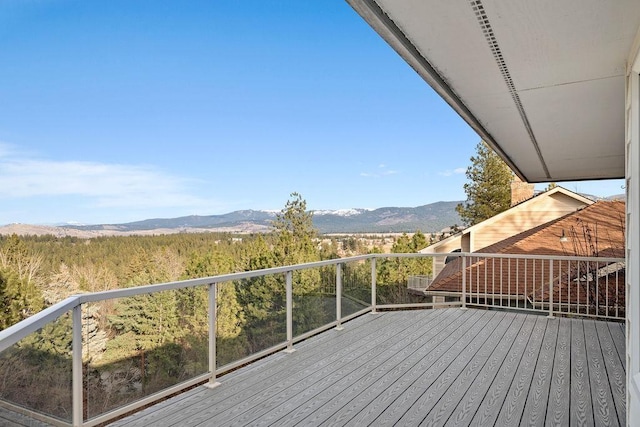 wooden terrace featuring a mountain view