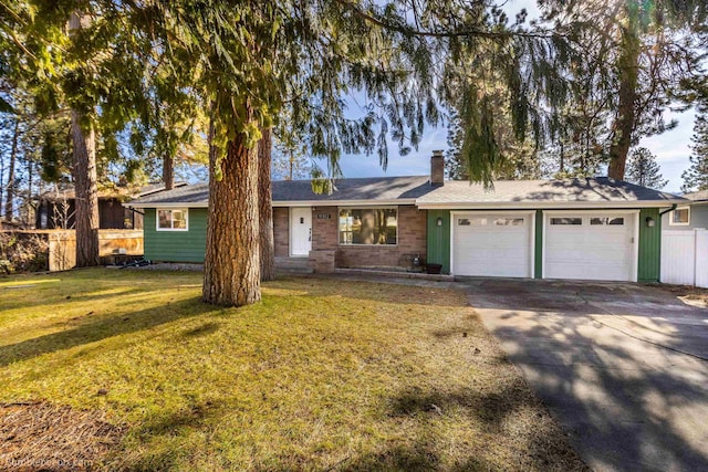 ranch-style home featuring fence, an attached garage, a chimney, a front lawn, and concrete driveway