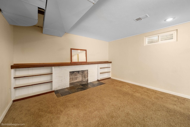 unfurnished living room with visible vents, baseboards, carpet flooring, recessed lighting, and a fireplace