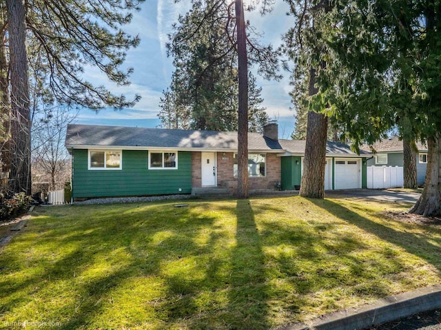 ranch-style house with a front yard, fence, a garage, and a chimney