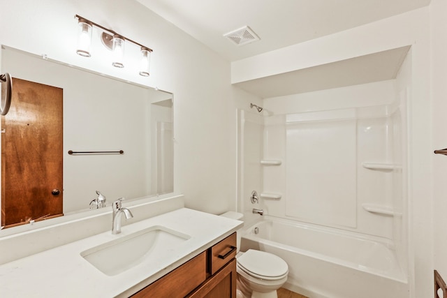 bathroom featuring visible vents, toilet, vanity, and bathing tub / shower combination