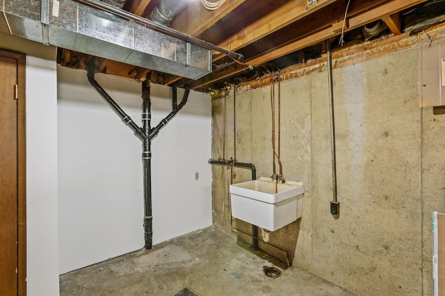 unfinished basement featuring a sink