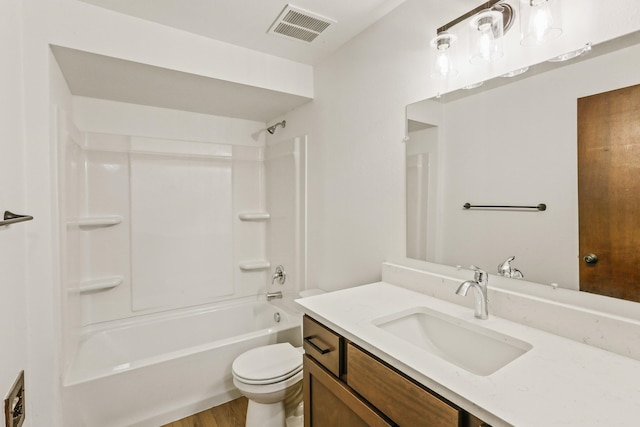 full bath featuring visible vents, toilet, shower / bathtub combination, wood finished floors, and vanity