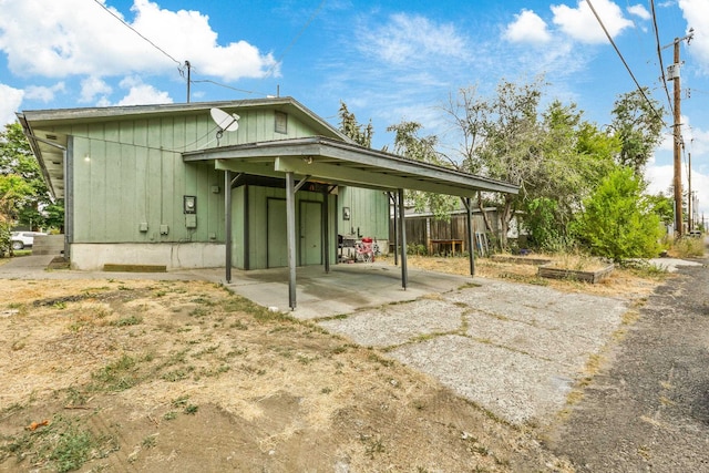 back of house featuring fence