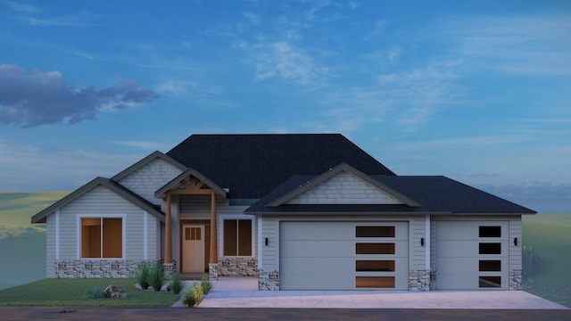 craftsman-style house featuring a garage, stone siding, and driveway