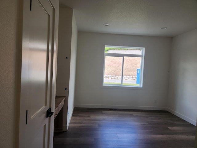 8712 E Ridgeline Ln, Spokane, WA 99217 - spare room with dark wood-style flooring and recessed lighting