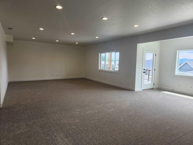 8712 E Ridgeline Ln, Spokane, WA 99217 - unfurnished room featuring carpet flooring and recessed lighting
