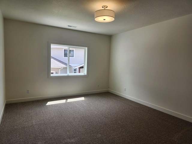 8712 E Ridgeline Ln, Spokane, WA 99217 - spare room with dark colored carpet and baseboards